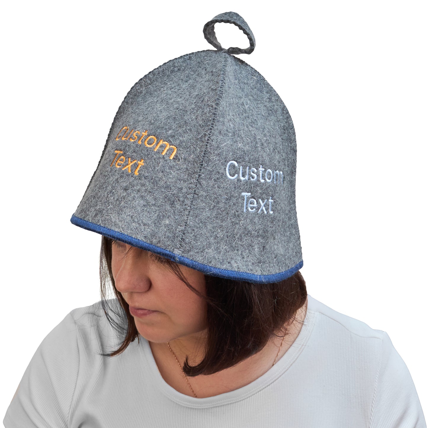 Gray wool sauna hat with blue trim and custom embroidered text, worn on a model to show fit and coverage