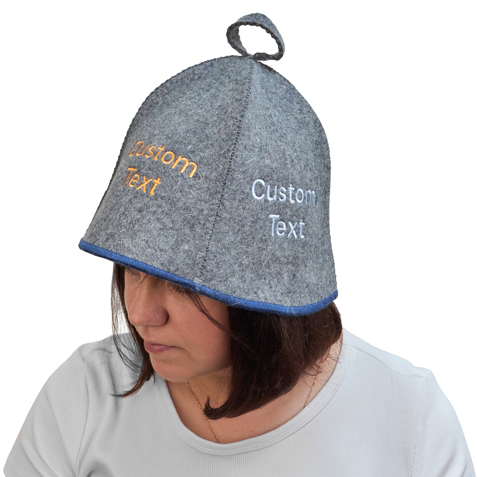 Gray wool sauna hat with blue trim and custom embroidered text, worn on a model to show fit and coverage