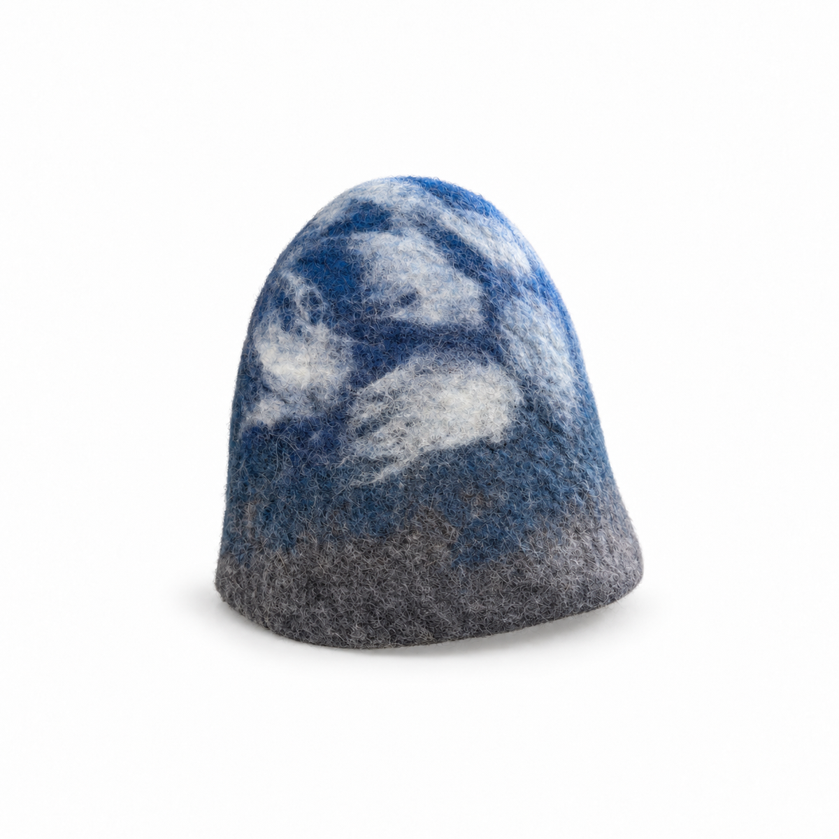 Hand-felted 100% wool sauna hat with a blue, gray and white mountain and cloudy sky design, shown from the side on a white background