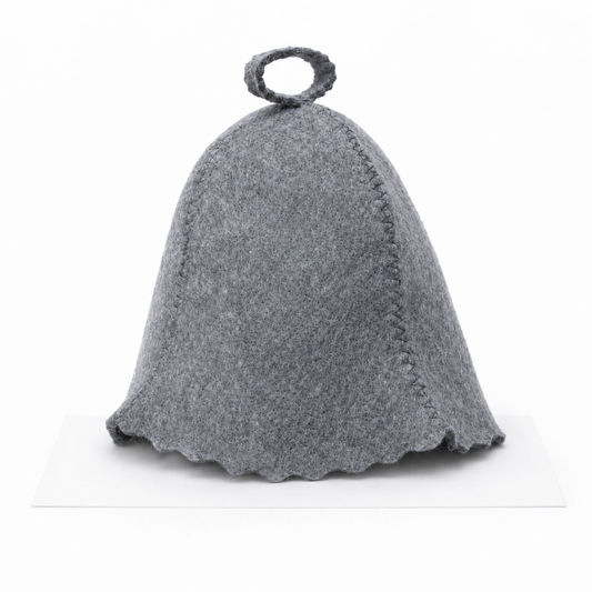 Natural gray wool sauna hat in a classic bell shape with visible stitched seams, scalloped bottom edge, and hanging loop at the top, shown from the front on a white background