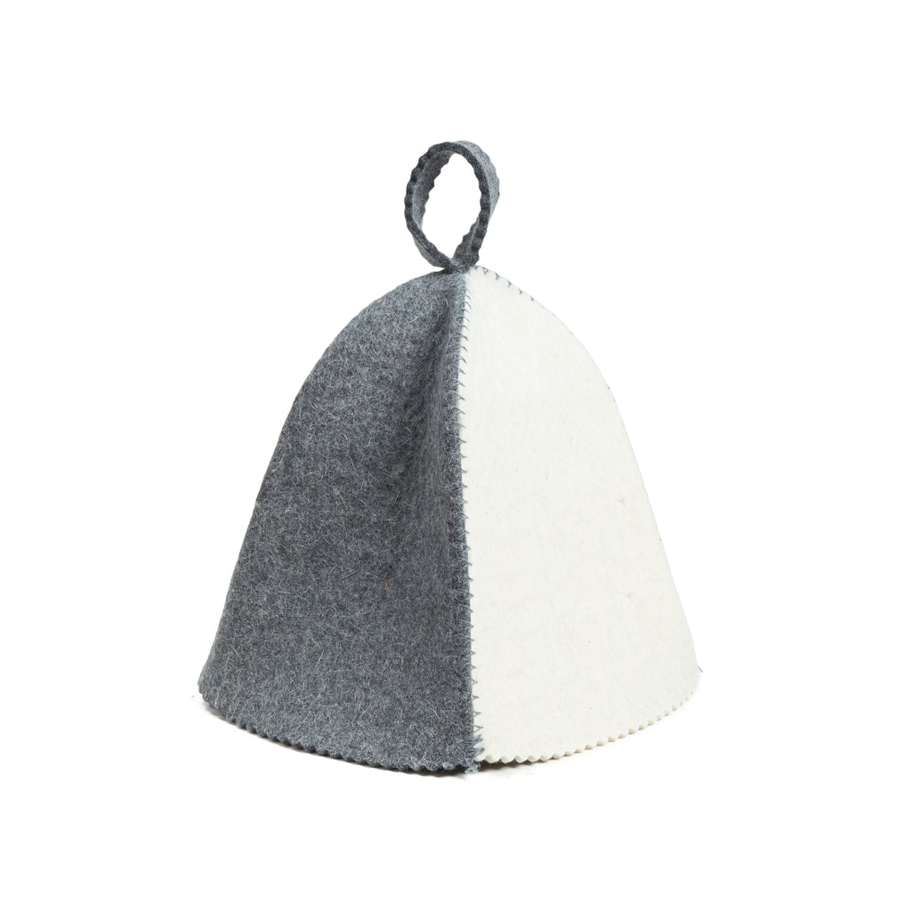Two-toned gray and white fabric teapot on a white background