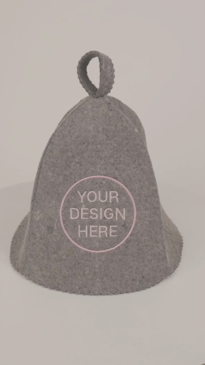 Video showing a gray wool sauna hat with custom logo embroidery, demonstrating the bell shape, natural wool felt texture, embroidered design, and overall construction from different angles