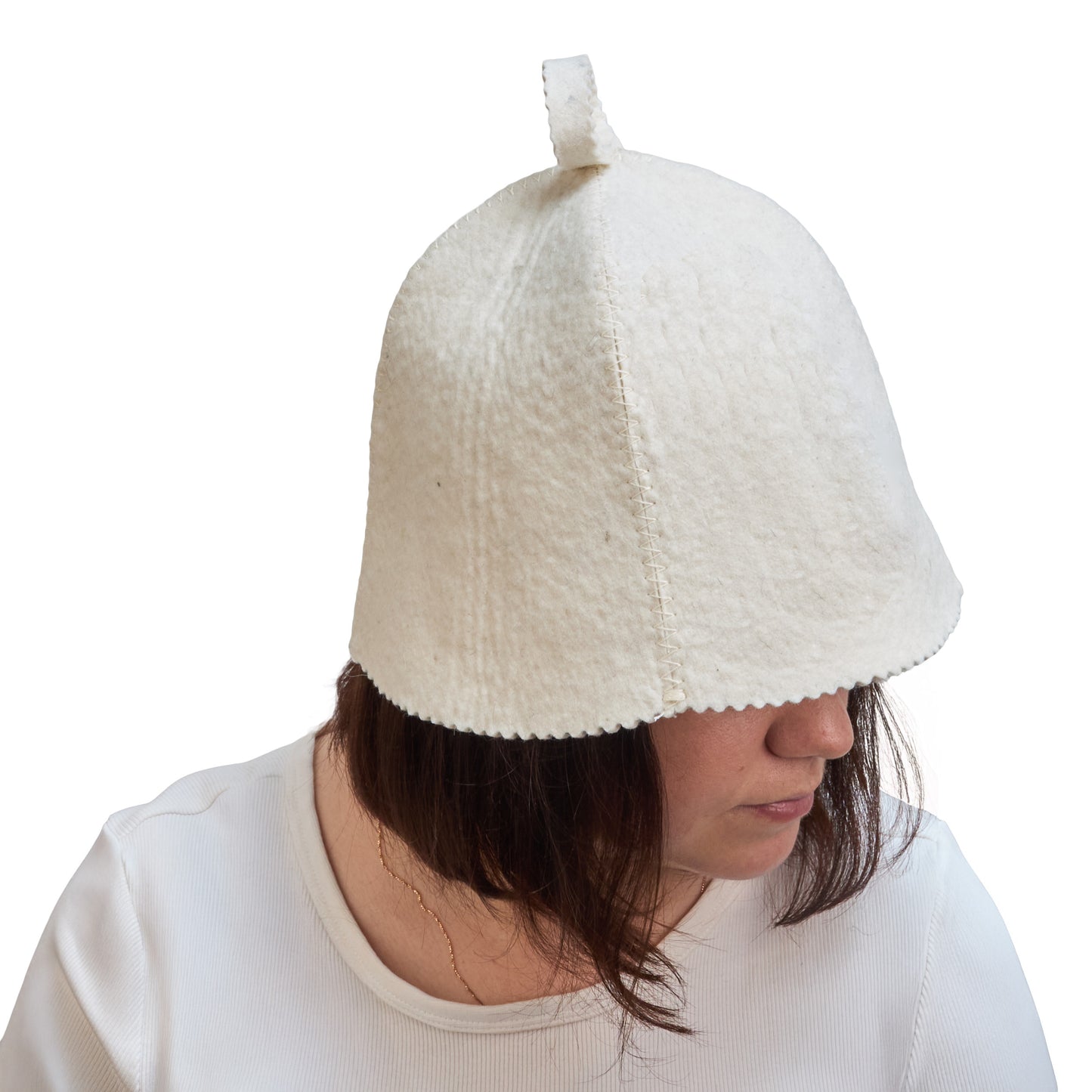 woman wearing a textured white sauna hat against a white background