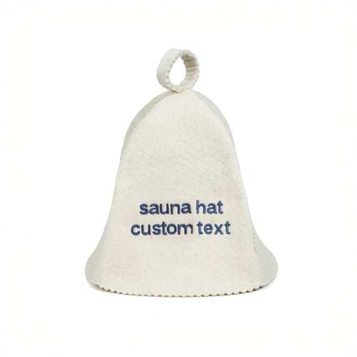 White sauna hat with embroidered text on it against a white background