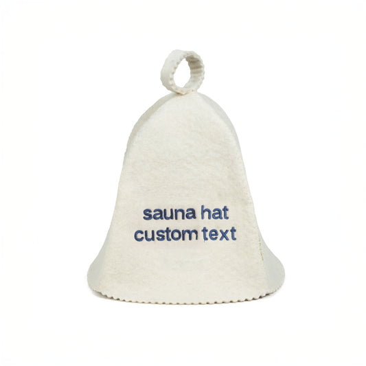 White sauna hat with embroidered text on it against a white background