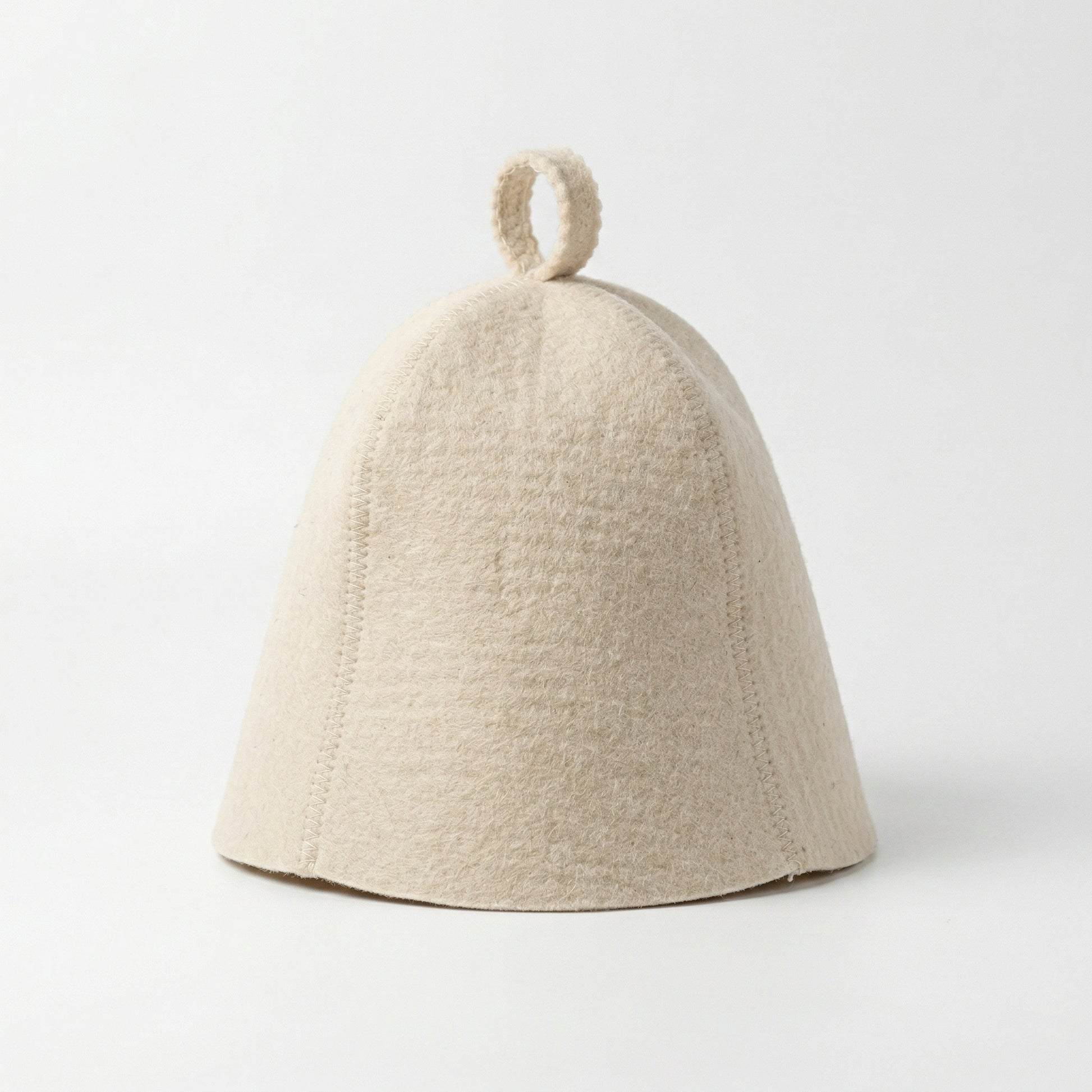 Front view of white wool sauna hat on a white background