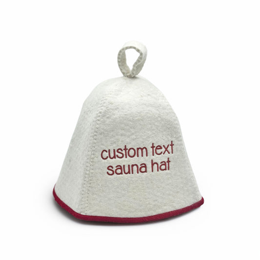 White sauna hat with red text embroidered